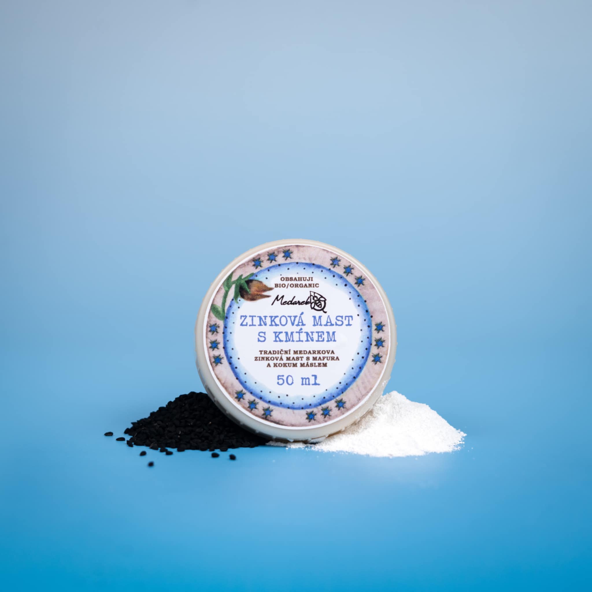 Medarek Zinc Ointment with Cumin (50 ml) tin, with black cumin seeds and white powder on a blue background.